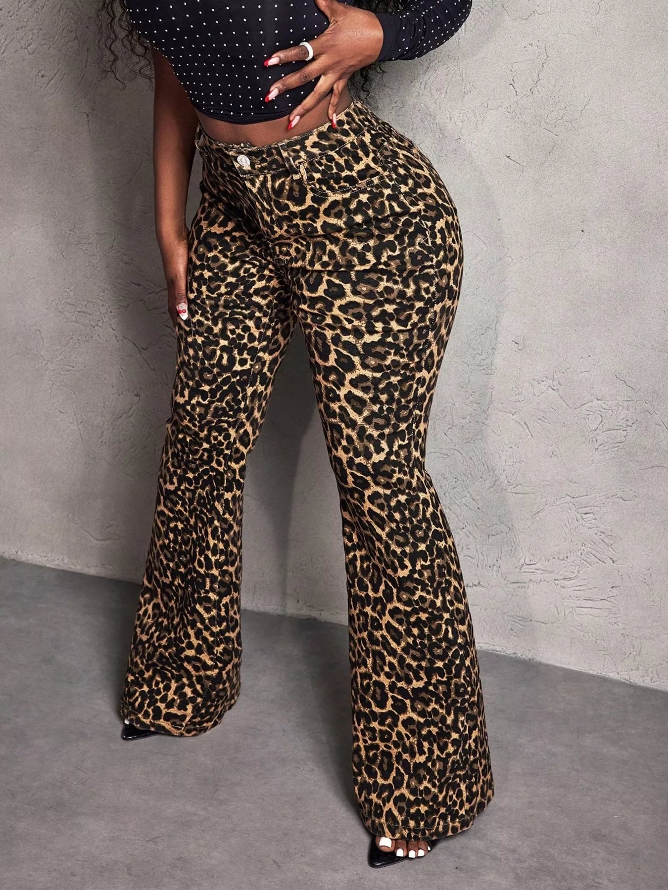 Leopard print wide-leg pants by Shopimist displayed on a model, showing the flowy silhouette and bold animal print fabric.