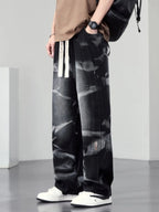 Men's plus size washed wide-leg jeans by Trendsi, showcasing relaxed fit, distressed denim, and casual style in a natural pose.