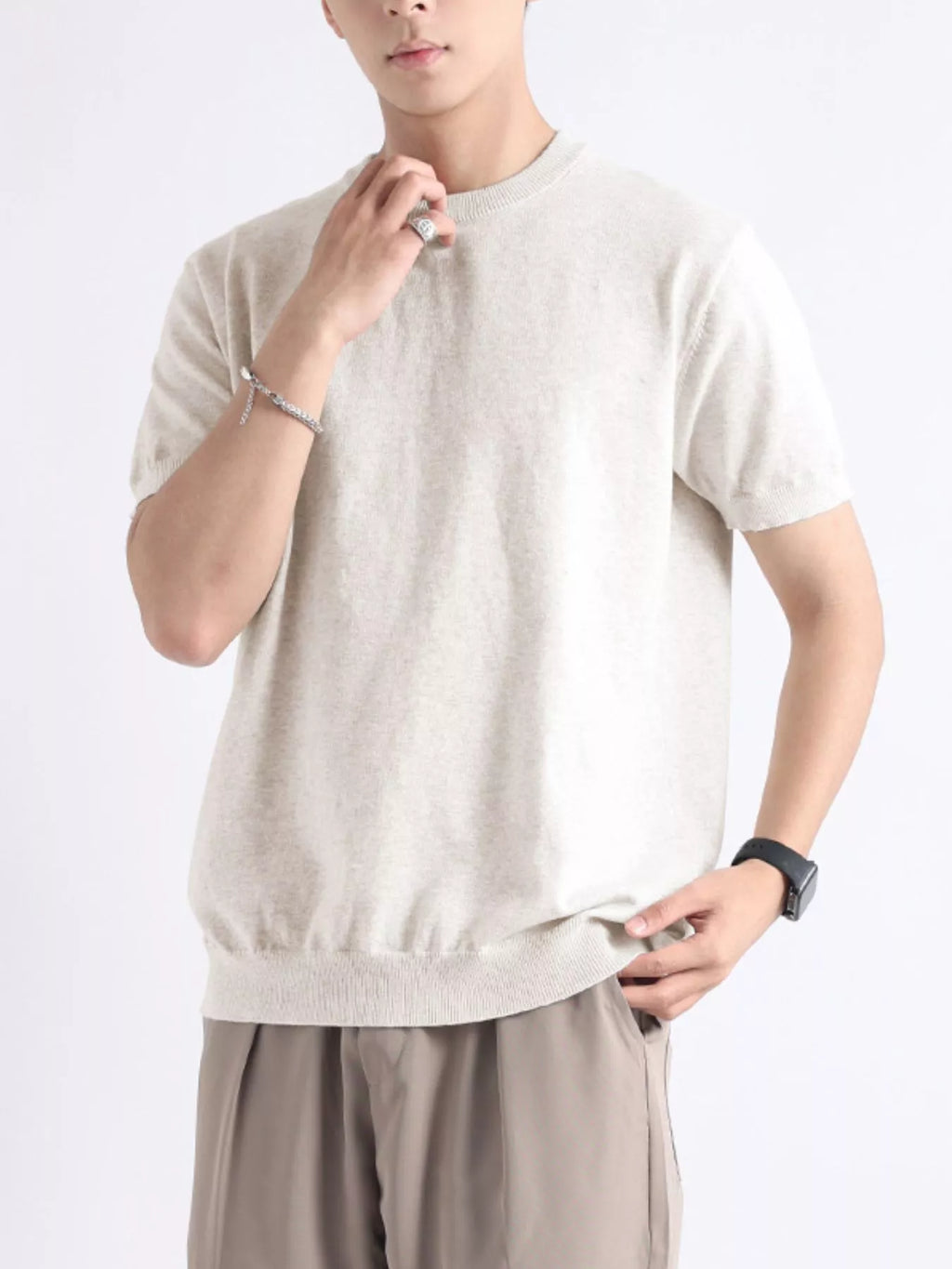 Plus size men's casual knitted short sleeve T-shirt from Trendsi, showing a comfortable, fitted knit top in a neutral color.