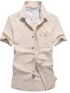 Men's plus size short-sleeve casual button-up shirt by Trendsi, featuring a relaxed fit and classic collar, in a versatile design.