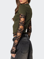 Women's elegant lace sleeve fitted T-shirt by Trendsi featuring sophisticated casual style and stylish lace detail on the sleeves.