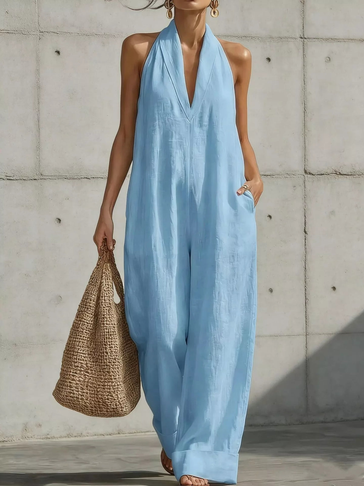 Plus size halter neck wide-leg jumpsuit from Plush Fashion Hub, featuring a stylish, full-length design with flowing fabric.