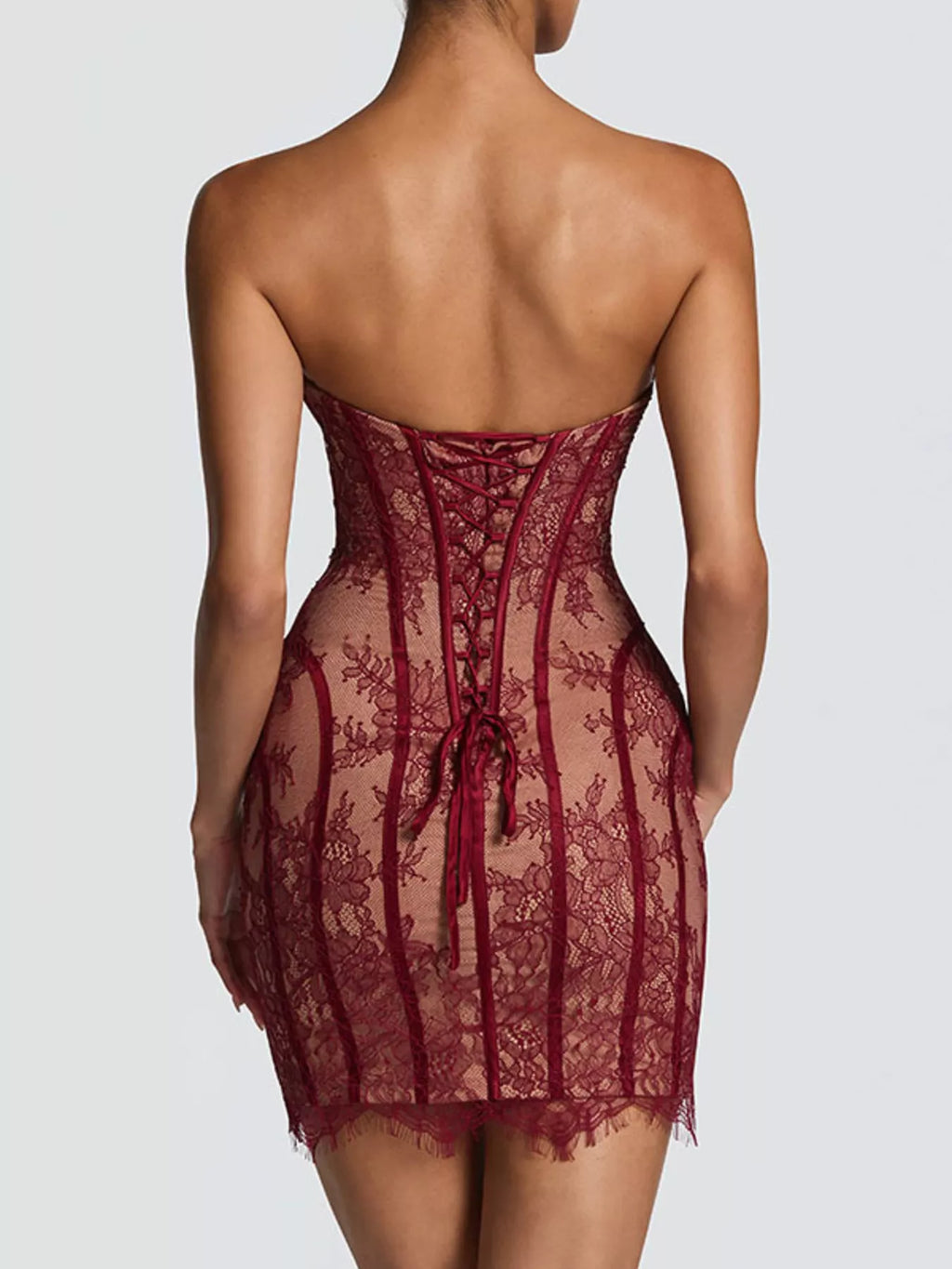 Lace detail tube mini dress from Trendsi featuring a fitted silhouette and elegant design, perfect for stylish occasions.