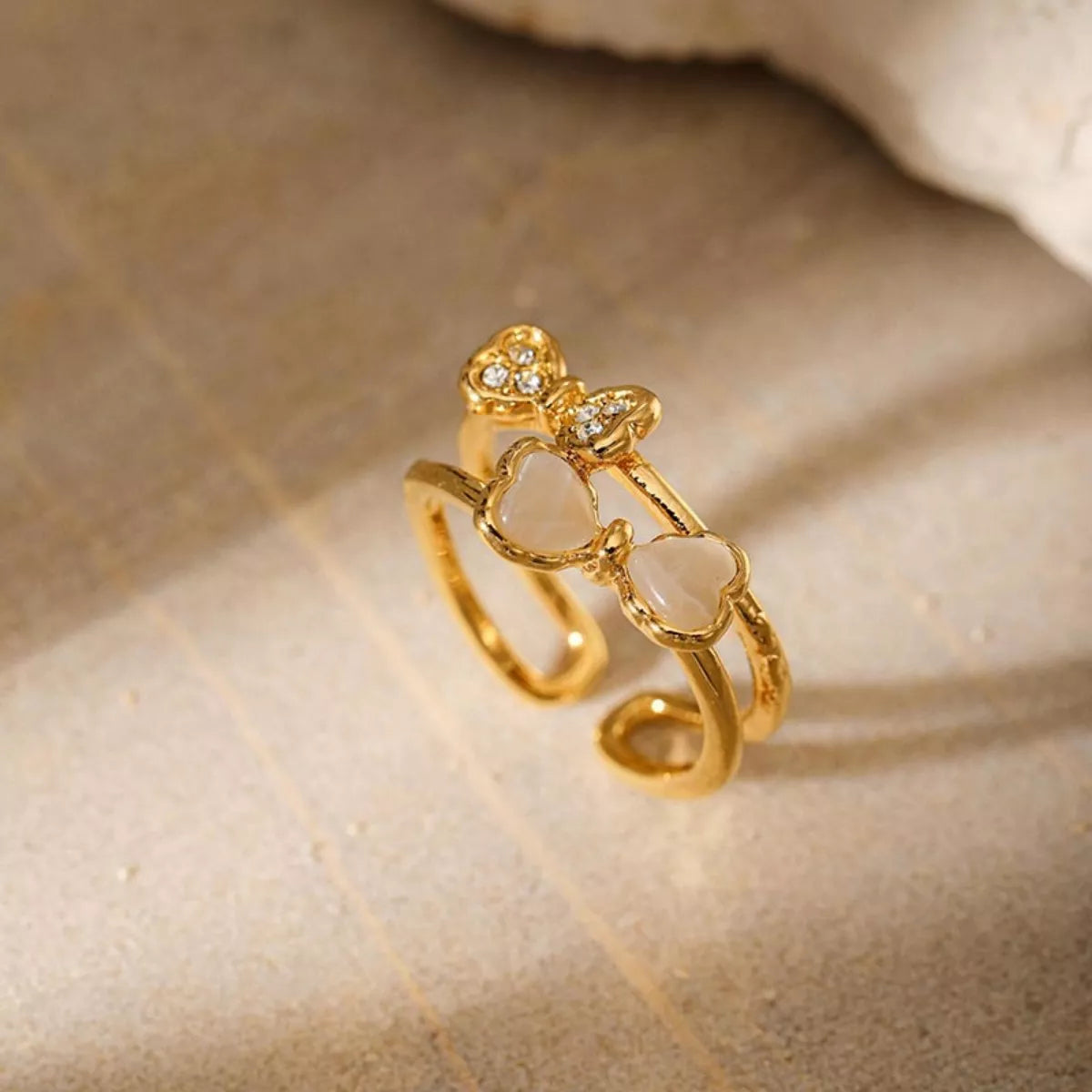 18K gold-plated bow open ring from Plush Fashion Hub featuring a delicate, elegant design on a clean background.