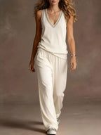 Plus size V-neck tank top and wide-leg pants set by Trendsi, featuring a stylish matching top and pants in a full size fit.