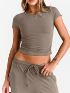 Women's round neck short sleeve T-shirt and drawstring lounge set, 2-piece set by Trendsi, soft fabric and casual fit.