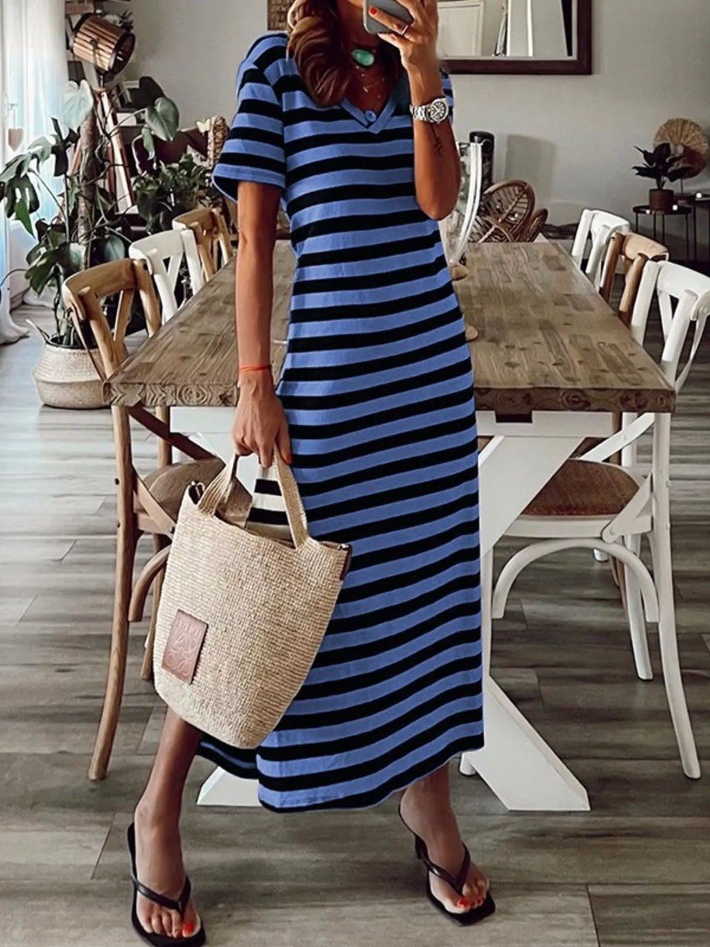 Plus size striped V-neck midi dress with side slit by Trendsi, featuring a full-length design and stylish pattern.