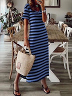 Plus size striped V-neck midi dress with side slit by Trendsi, featuring a full-length design and stylish pattern.