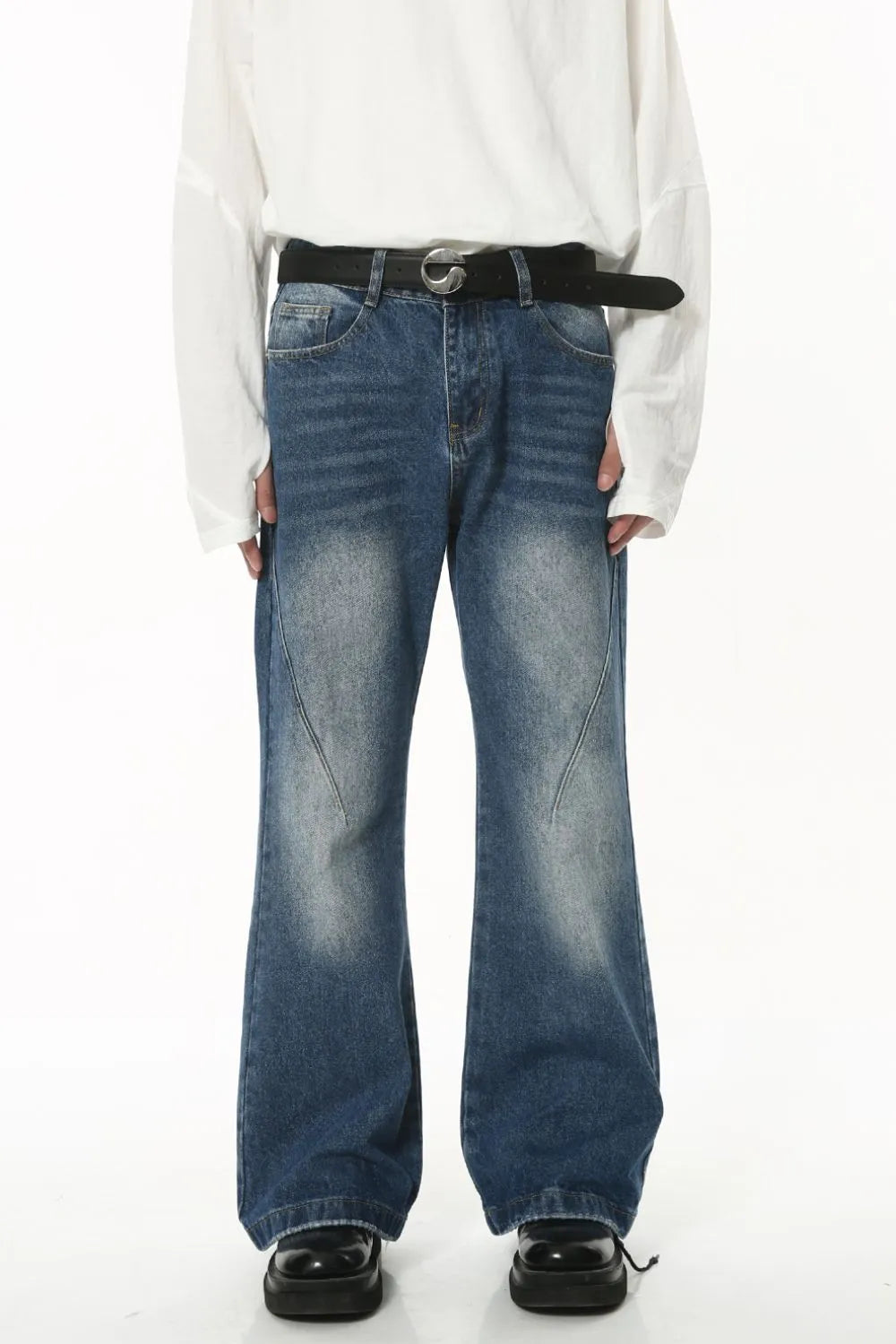 Washed denim jeans with front and back pockets from Plush Fashion Hub, casual fit, showcasing the distressed denim texture.