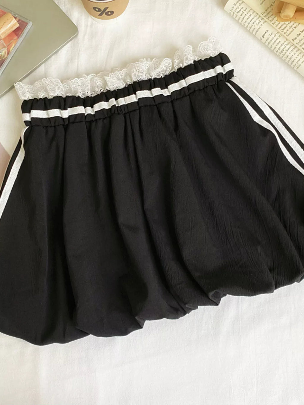 Lace trim elastic waist mini skirt in soft fabric, stylish and comfortable, perfect for casual or dressy occasions.
