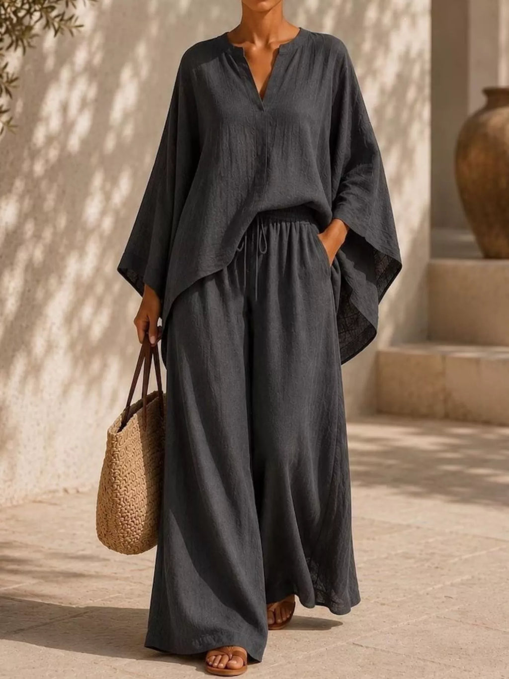 Plus size Trendsi loungewear set with long sleeve notched top and wide-leg pants, shown in a comfortable, casual fit.