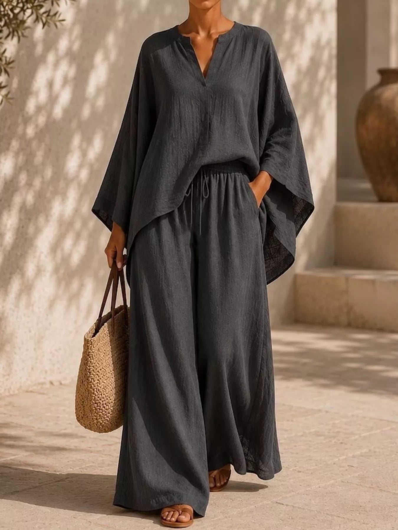 Plus size Trendsi loungewear set with long sleeve notched top and wide-leg pants, shown in a comfortable, casual fit.