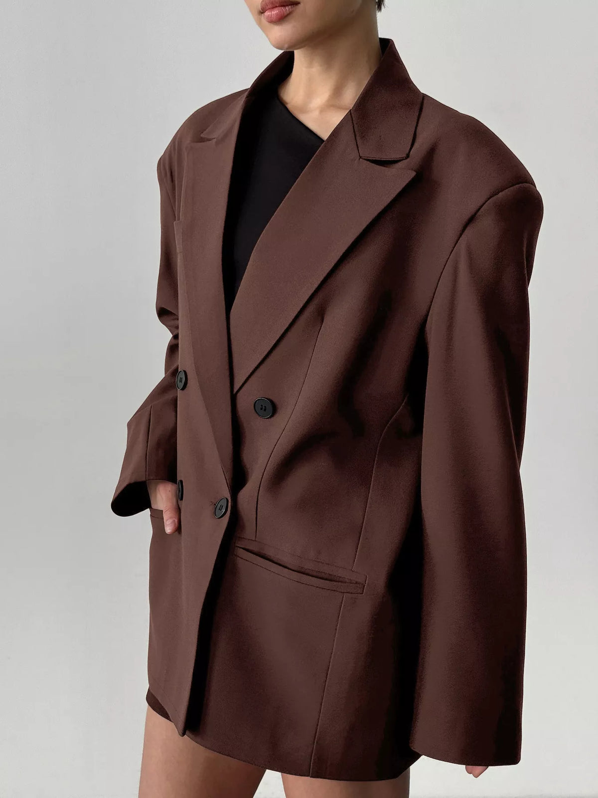 Trendsi double-breasted blazer with lapel collar, tailored fit, in a stylish neutral color, shown on a hanger.