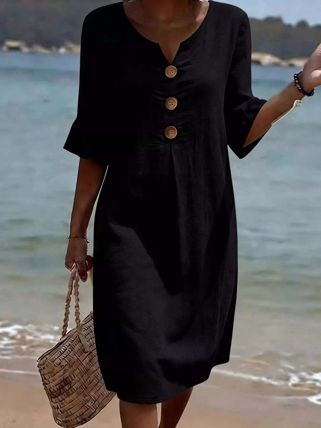 Plus size midi dress with ruffle sleeves and button decor from Trendsi, featuring a full-size, stylish and flowy design.