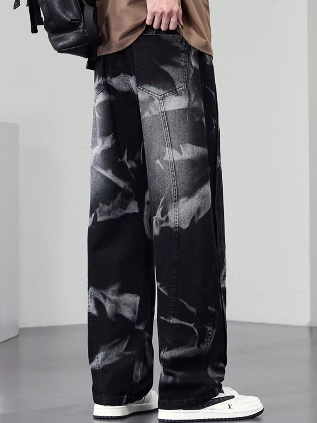Men's plus size washed wide-leg jeans from Trendsi, showing the relaxed fit and distressed denim style.