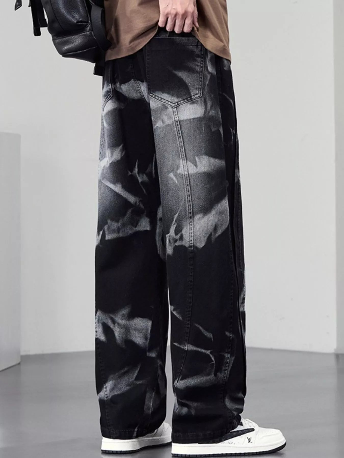 Men's plus size washed wide-leg jeans from Trendsi, showing the relaxed fit and distressed denim style.