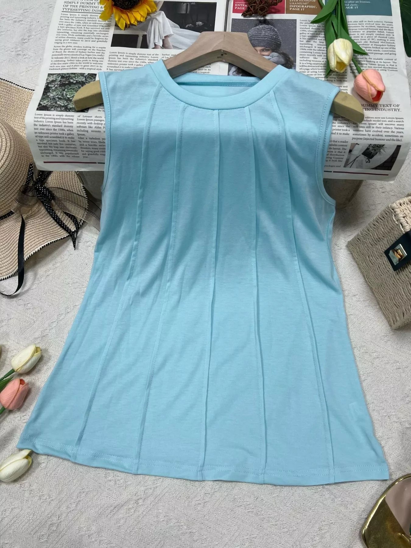 Trendsi round neck tank top for women, sleeveless casual top in soft fabric, shown in a natural pose.