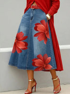 Women's floral print A-line midi denim-style boho skirt by Plush Fashion Hub, featuring a flowy, patterned design.