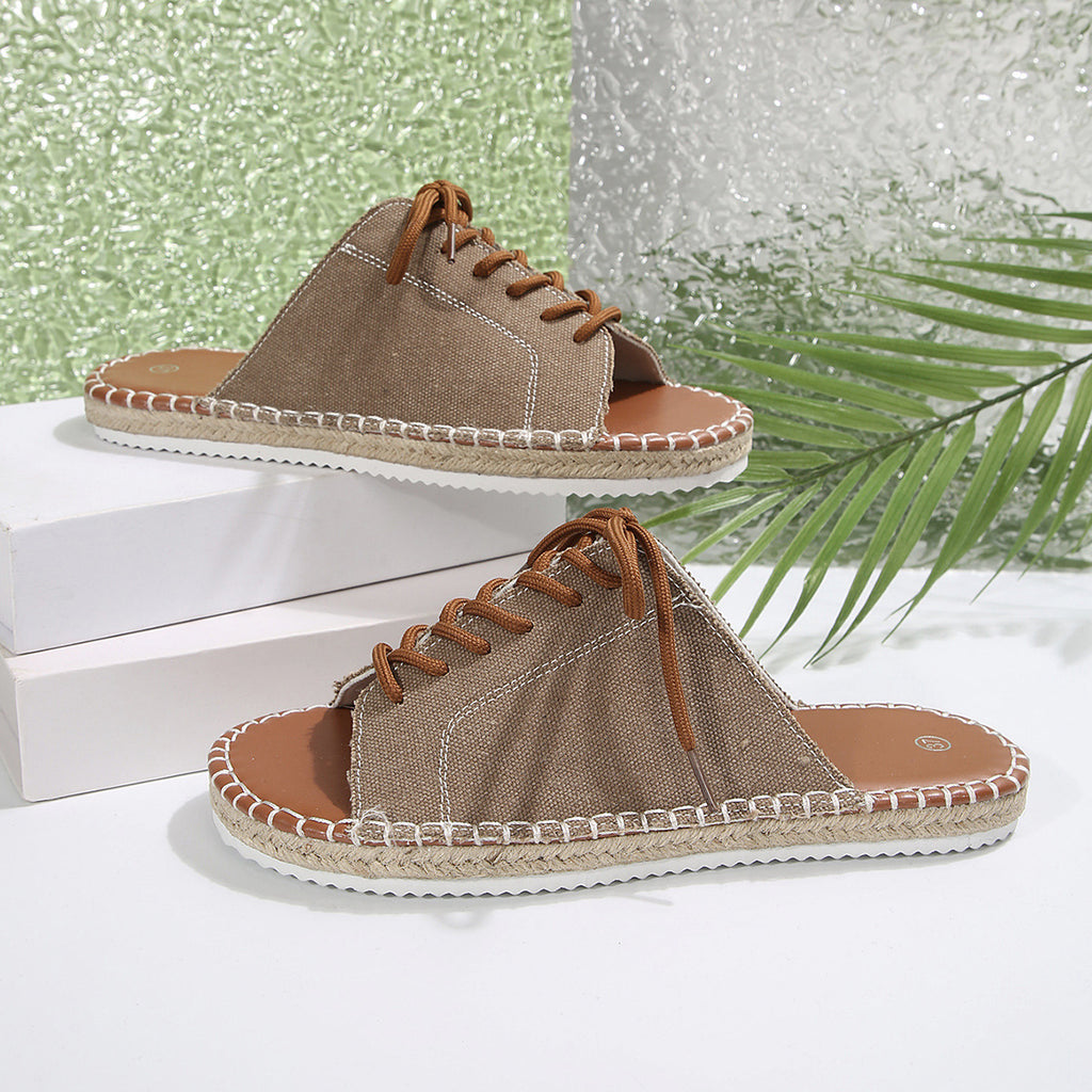 Women's lace-up open toe flat sandals in faux leather with ankle ties, stylish and comfortable footwear by Trendsi.