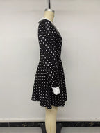 Polka dot Peter Pan collar dress by Shopimist featuring a classic design with a rounded collar and playful black and white polka dots.