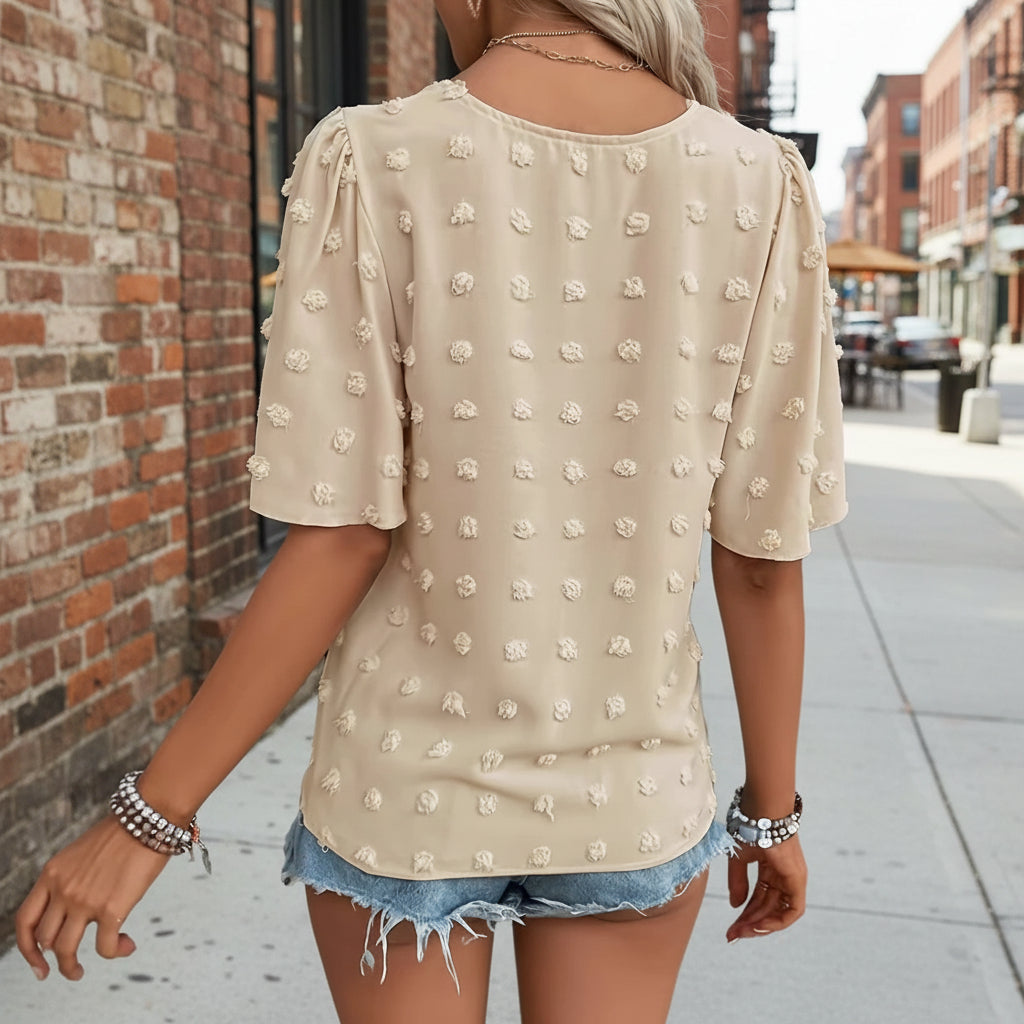 Women's V-neck lace-trim Swiss dot short-sleeve top by Plush Fashion Hub, casual loose fit, lightweight fabric, and feminine lace details.