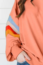 Contrast round neck long sleeve sweatshirt from Trendsi, showing a stylish top with a relaxed fit and color-block design.