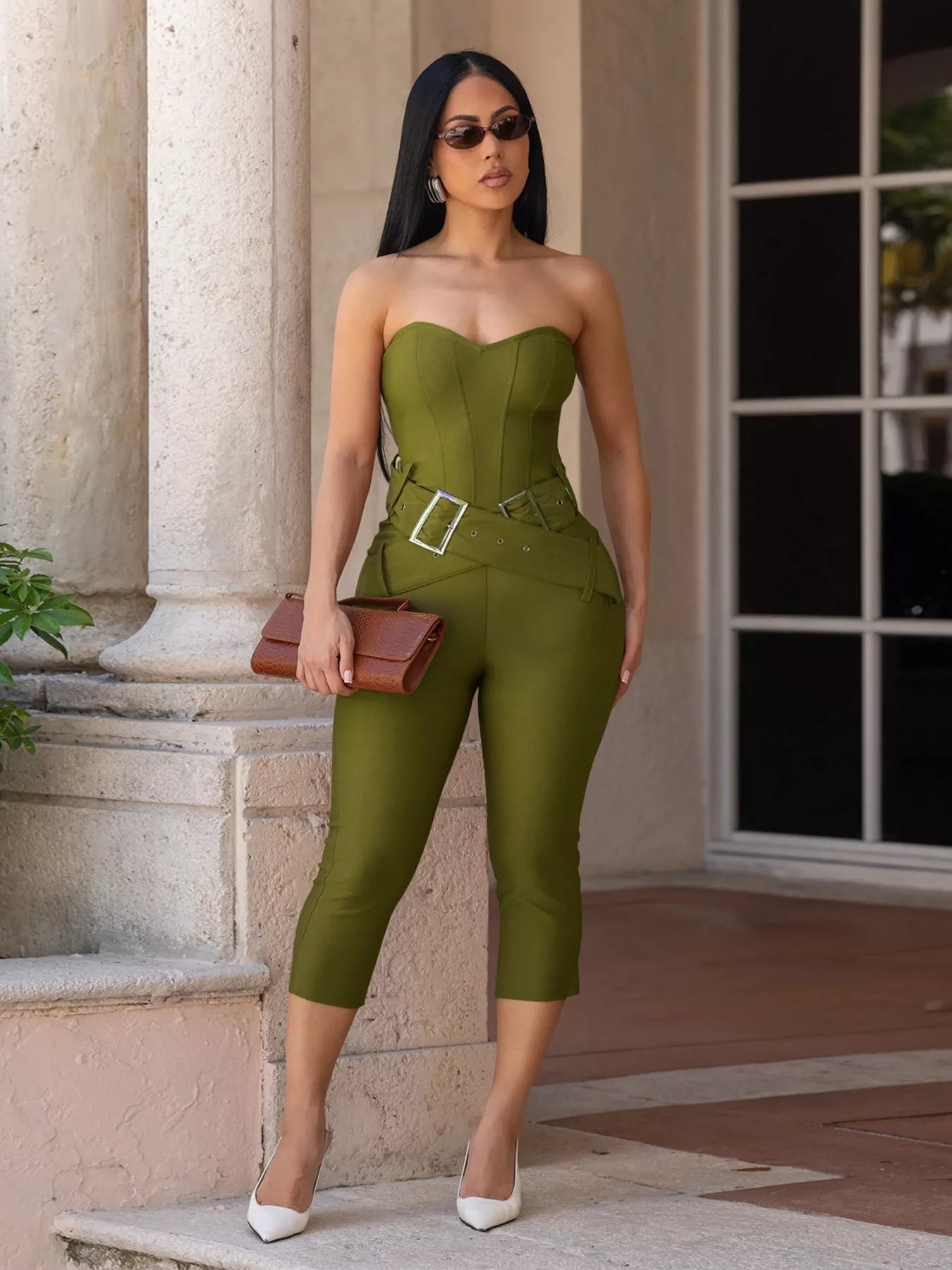 Black belted tube skinny jumpsuit from Trendsi featuring a fitted silhouette and adjustable waist belt.