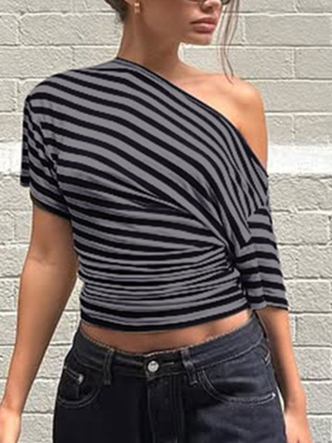Women's chic striped one-shoulder T-shirt by Trendsi featuring an asymmetrical design and comfortable fit.