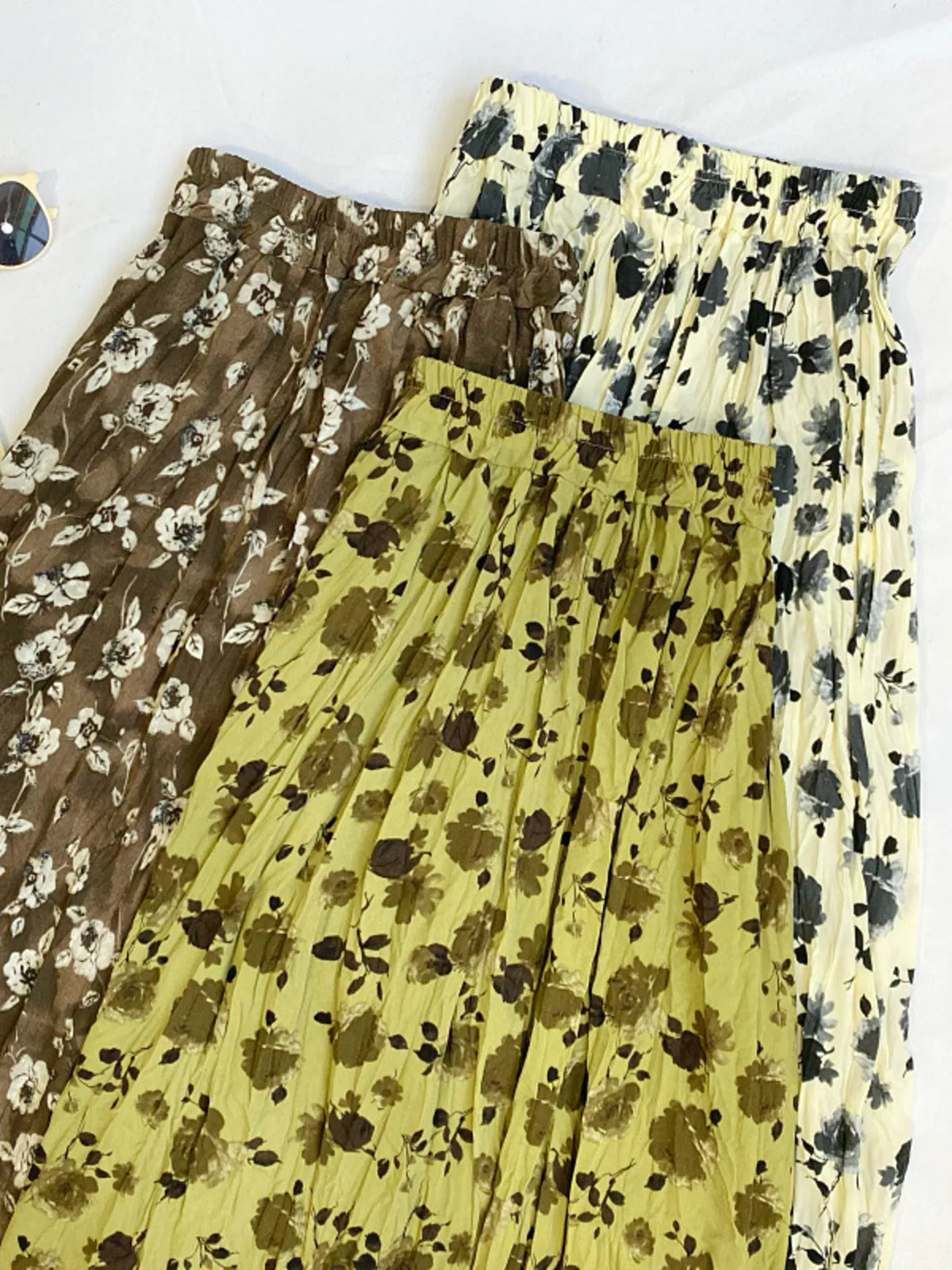 Floral print elastic waist midi skirt by Plush Fashion Hub, showcasing a flowy design with vibrant floral patterns.