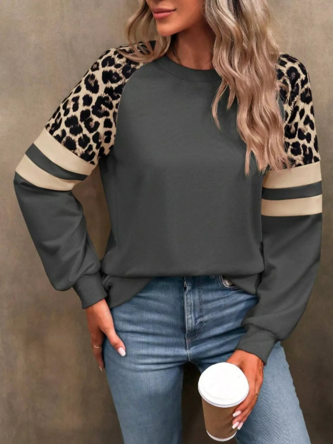 Leopard raglan sleeve striped sweatshirt by Simply Love featuring a cozy fit with leopard print and contrasting striped sleeves.