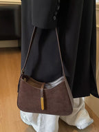Shopimist adjustable strap shoulder bag with a sleek design, featuring a spacious interior and versatile carrying options.