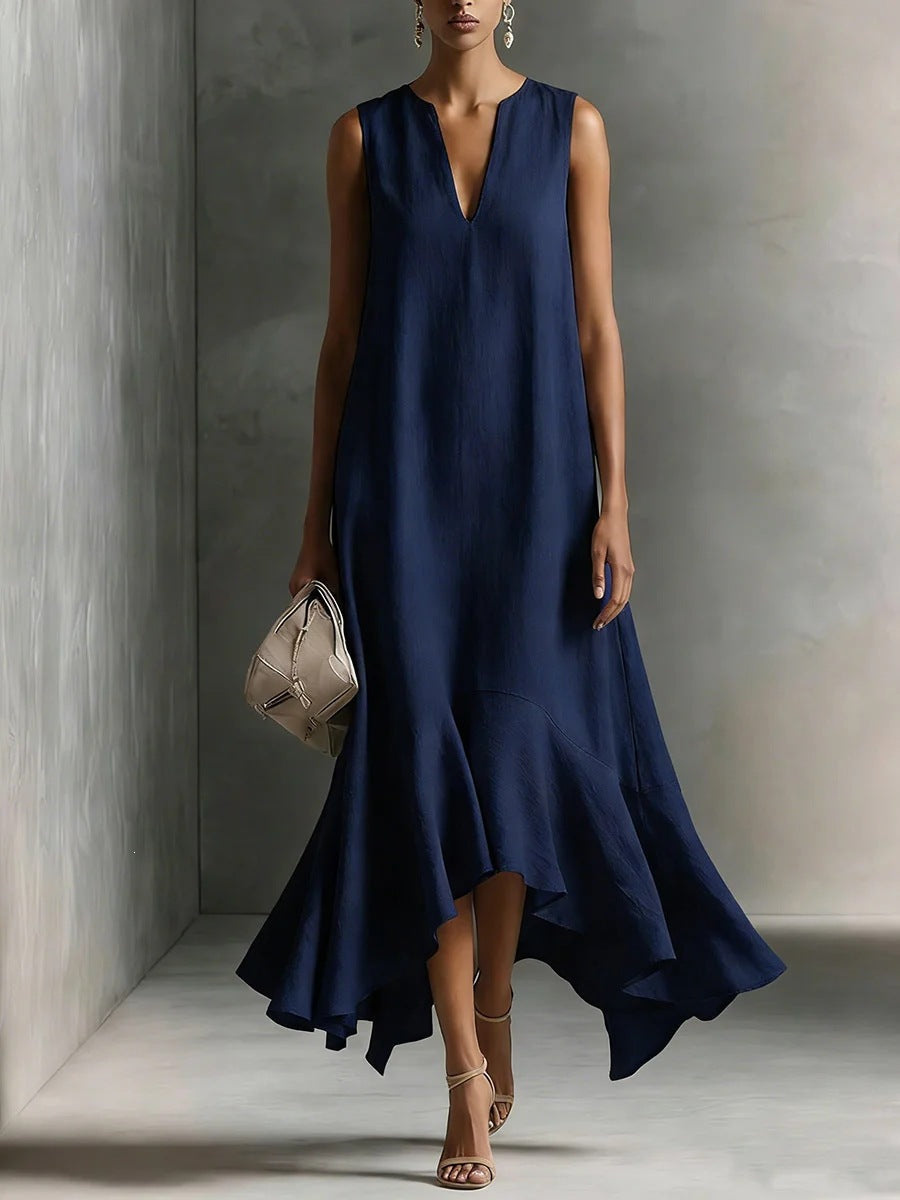 Women's deep V-neck sleeveless asymmetrical patchwork maxi dress by FitiqueFit, showcasing a flowing design and vibrant fabric details.