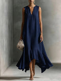 Women's deep V-neck sleeveless asymmetrical patchwork maxi dress by FitiqueFit, showcasing a flowing design and vibrant fabric details.