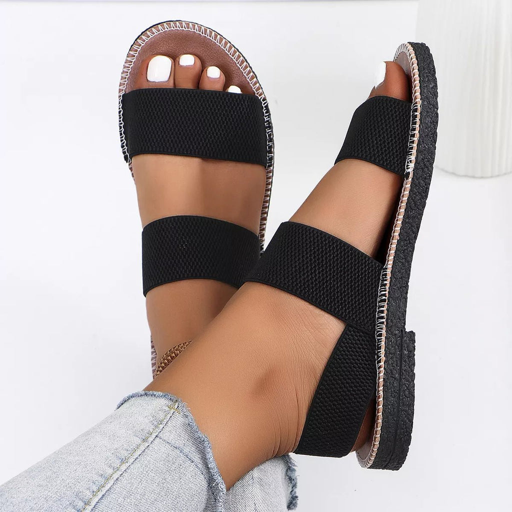 Women's elastic band open toe flat sandals by Trendsi, slip-on summer shoes with comfortable open-toe design and elastic straps.