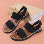 Women's open-toe flat sandals with elastic bands by Trendsi, featuring slip-on design and comfortable summer footwear style.