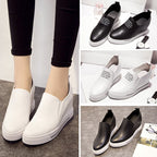 Elevated slip-on women's shoes with thick soles in black, featuring a sleek design from Plush Fashion Hub.
