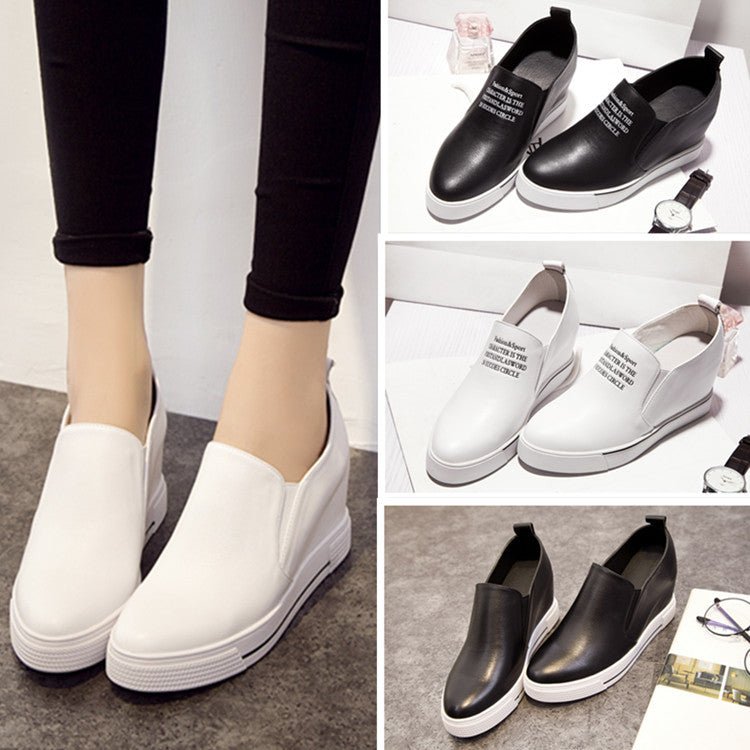 Elevated slip-on women's shoes with thick soles in black, featuring a sleek design from Plush Fashion Hub.