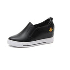 Elevated slip-on women's shoes with thick soles, featuring a sleek design and comfortable fit from Plush Fashion Hub.