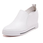 Elevated slip-on women's shoes with a thick sole, featuring sleek design and comfortable fit from Plush Fashion Hub.