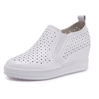 Elevated slip-on women's shoes with thick soles from Plush Fashion Hub, showcasing a stylish and comfortable footwear design.