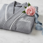 Knee-length waffle robe for women with embroidery detail, made by Plush Fashion Hub, featuring a soft, textured fabric and cozy fit.