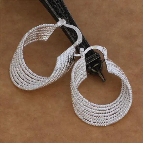 Multi-string 925 silver fashion earrings featuring layered silver strands with a polished finish, stylish accessory by Plush Fashion Hub