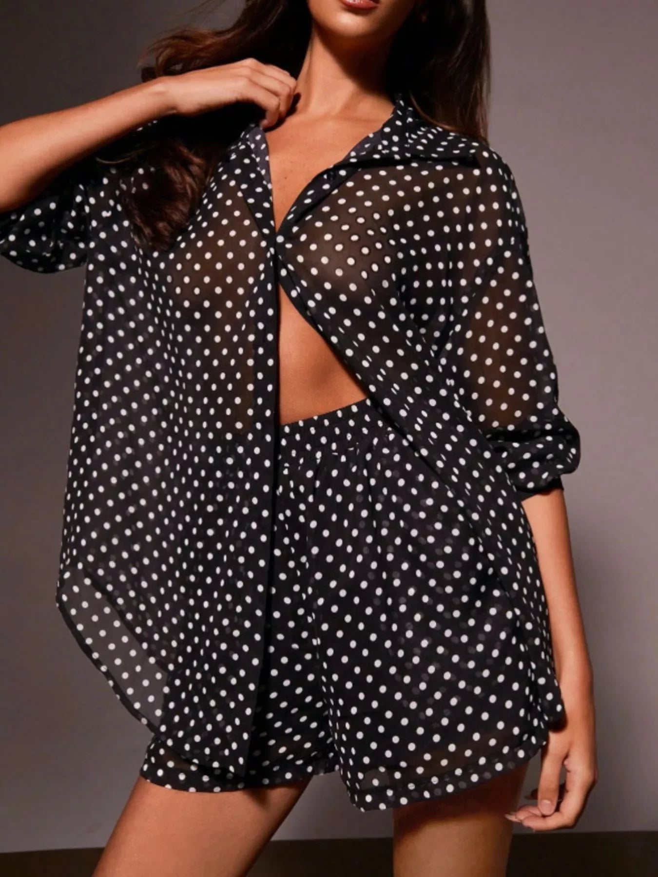 Polka dot button-up shirt and shorts set by Plush Fashion Hub, featuring a playful polka dot pattern and casual summer style.
