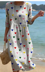 Plus-size patchwork maxi dress by FitiqueFit, relaxed fit casual dress with colorful patchwork design and flowing silhouette.