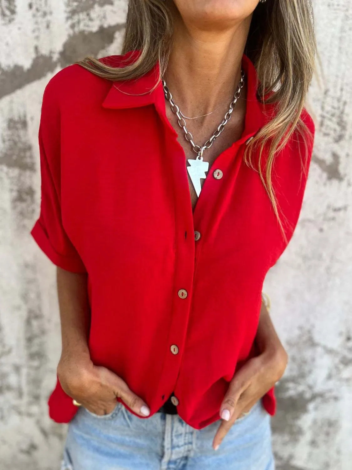 Women's collared half sleeve button-down blouse by Trendsi, featuring a sophisticated office top with a classic design.