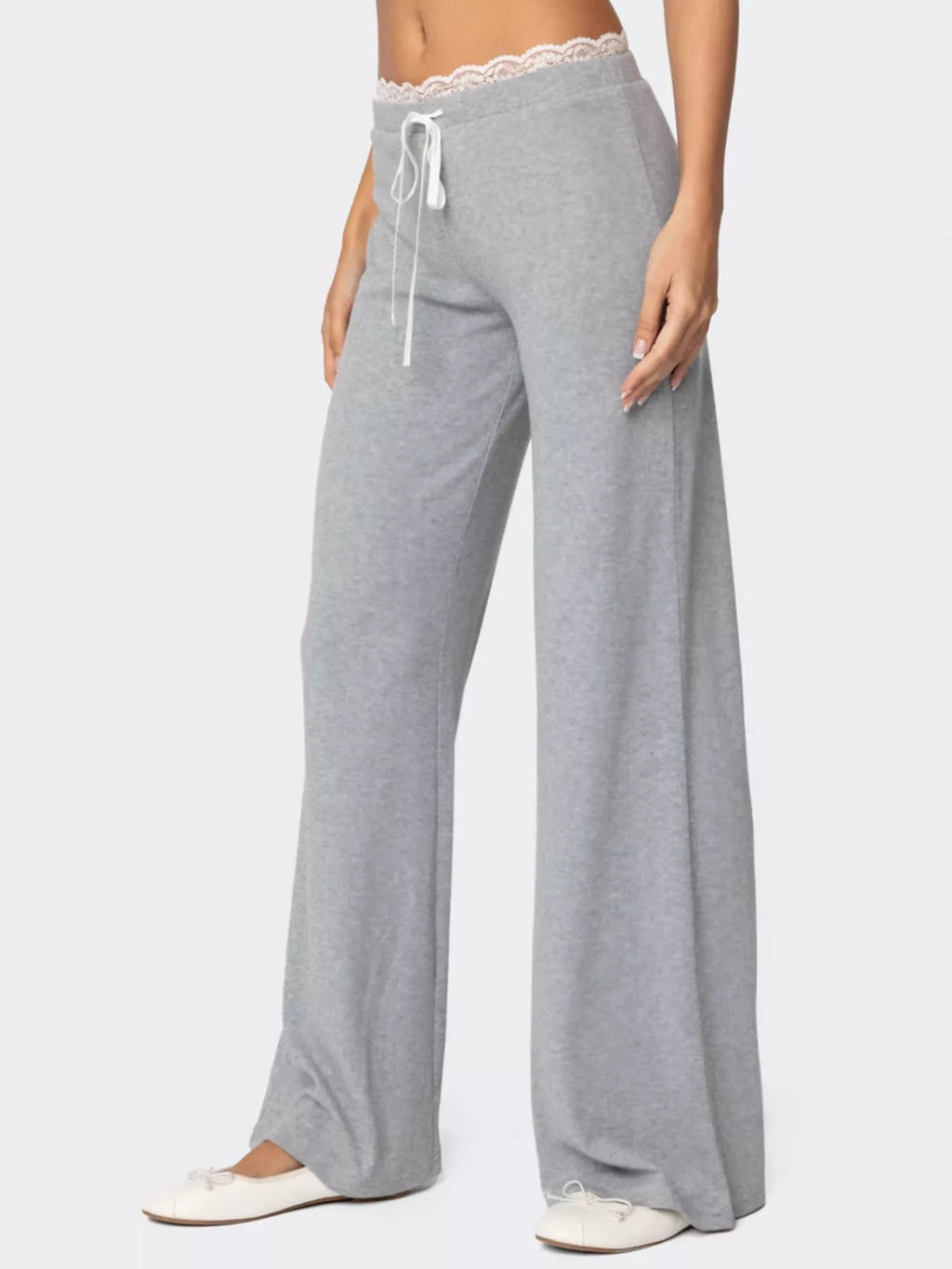 Women's wide-leg lounge pants with lace trim and tie waist by Trendsi, featuring a relaxed fit and elegant design.