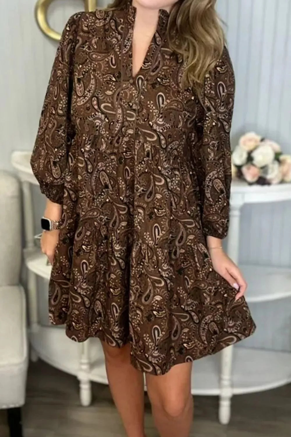 Paisley print notched mini dress by Plush Fashion Hub, featuring a stylish design with a notched neckline and vibrant pattern.