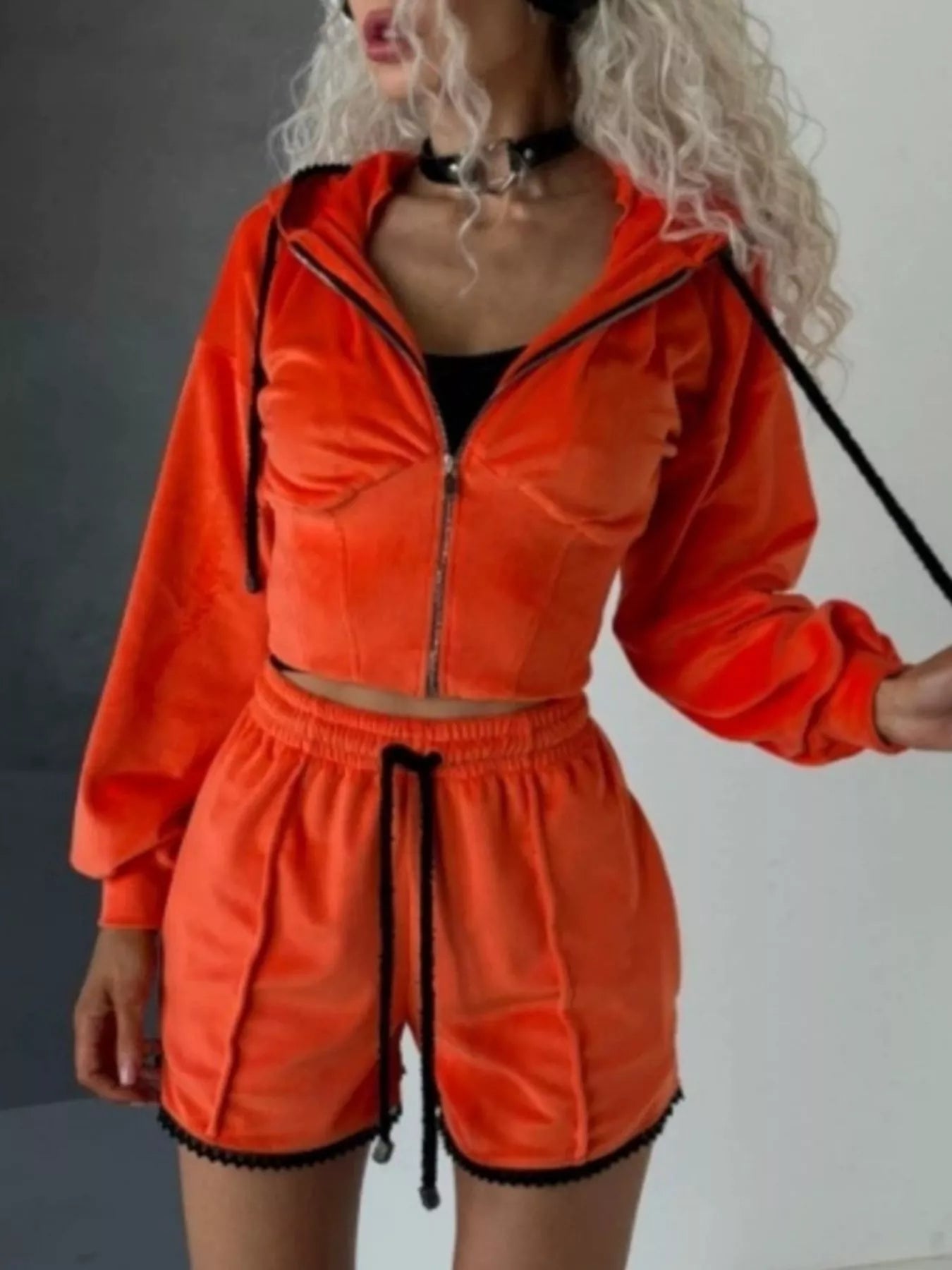 Trendsi zip-up hooded outerwear and shorts set, featuring a matching jacket with hood and casual shorts for a stylish, relaxed look.