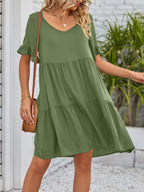 Lightweight rayon mini dress with ruffled sleeves, tiered design, and pockets, featuring a trendy, casual style.