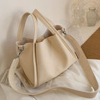 Plush Fashion Hub Kira handbag, stylish leather handbag with top handles and modern design, shown in a close-up view.